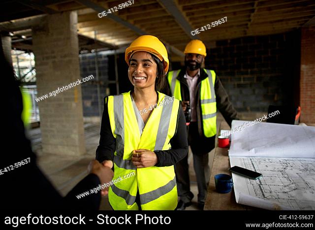 Happy construction workers at construction site