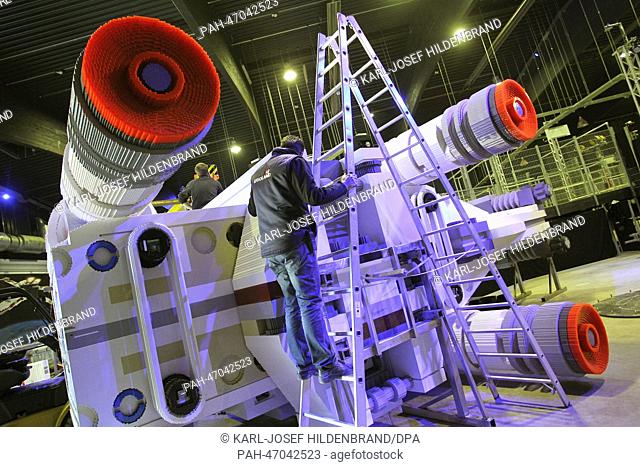 Technicians put together a model spaceship ""Lego Star Wars X-Wing"" at the Legoland Amusement Park near Guenzburg, Germany, 12 March 2014