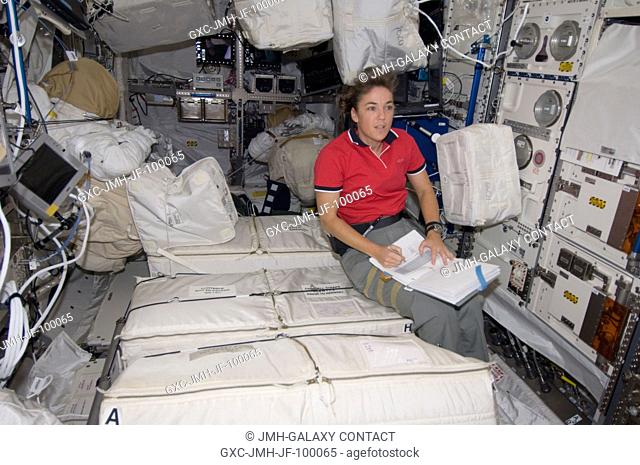 Astronaut Heidemarie Stefanyshyn-Piper, STS-126 mission specialist, works with transfer of supplies in the Columbus lab of the International Space Station
