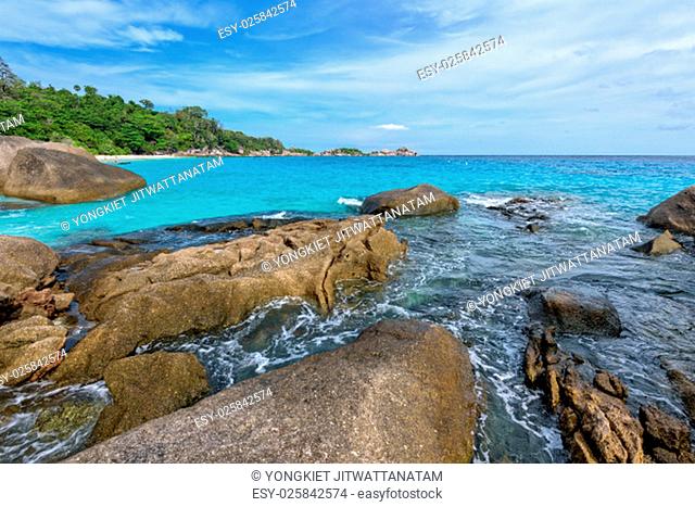 Beautiful landscape of blue sky sea and white waves on beach near the rocks during summer at Koh Miang island in Mu Ko Similan National Park, Phang Nga province