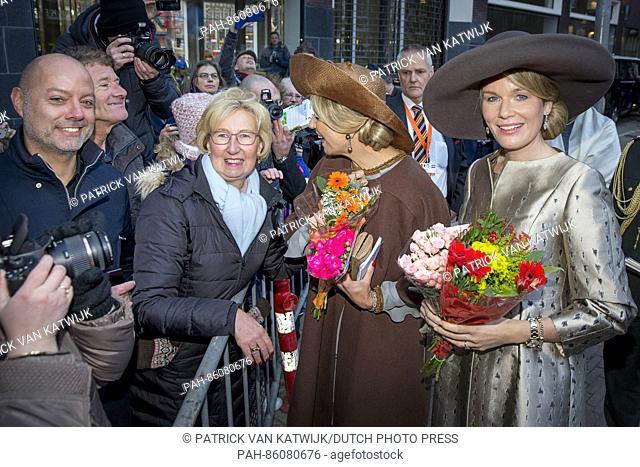 Queen Mathilde of Belgium and Queen Maxima of The Netherlands with well wishers during their visit to the Flemish culture house de Brakke Grond in Amsterdam