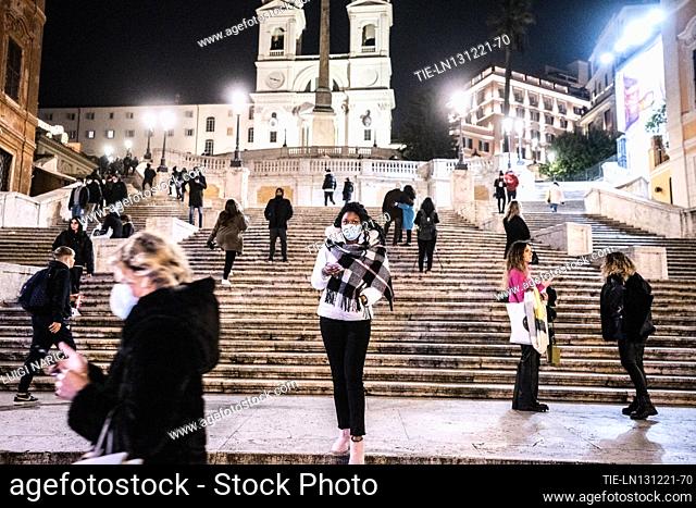 The shopping streets during the Christmas period during the coronavirus pandemic, Piazza Di Spagna, stairway of Trinità dei Monti in Rome , ITALY-11-12-2021