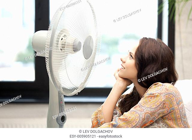 picture of happy woman with big fan