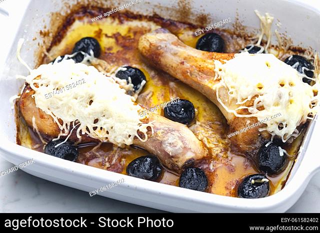chicken legs baked with black olives and cheese