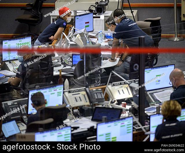 Launch teams monitor the countdown to the launch of Arianespace's Ariane 5 rocket carrying NASA’s James Webb Space Telescope, Saturday, Dec