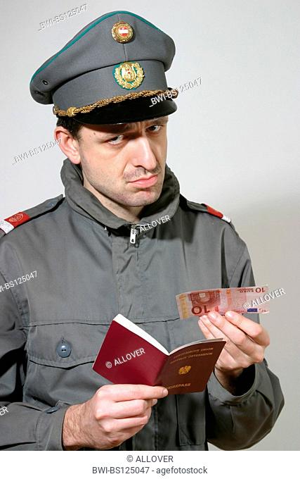 customs officer checking passport with 10 Euro bill inside