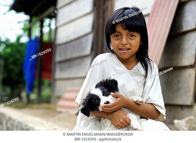 Child of the Lacandon Maya with a dog in the rainforest of Chiapas, last descendants of the Maya, Mexico, North America