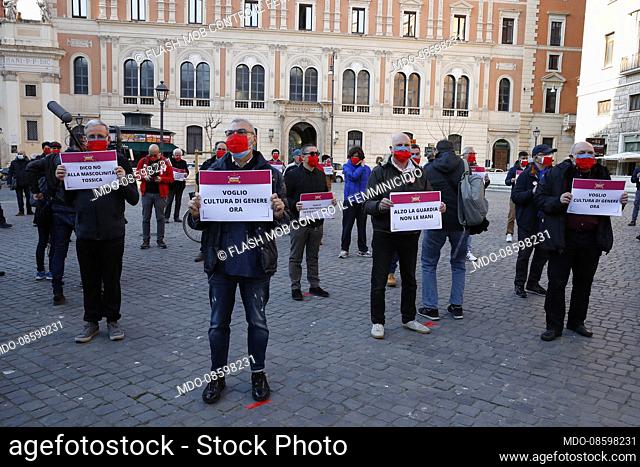 Flash mob in Piazza San Silvestro organized by the Liberare Roma association to demonstrate against male violence against women