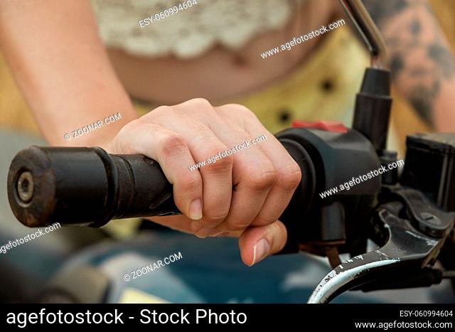Cropped Woman Hand Riding Motorcycle