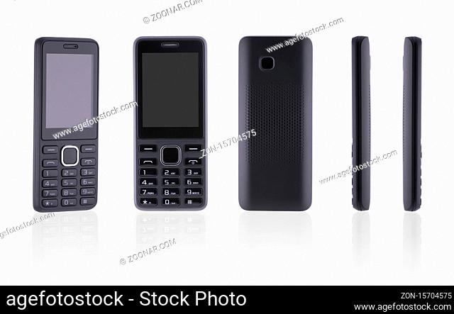 from different angles push-button mobile phone on white background with reflection