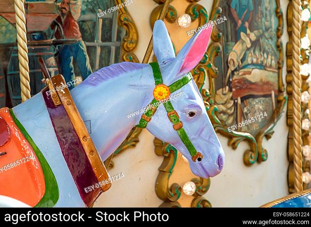 Colorful wooden donkeyof a children circus carousel