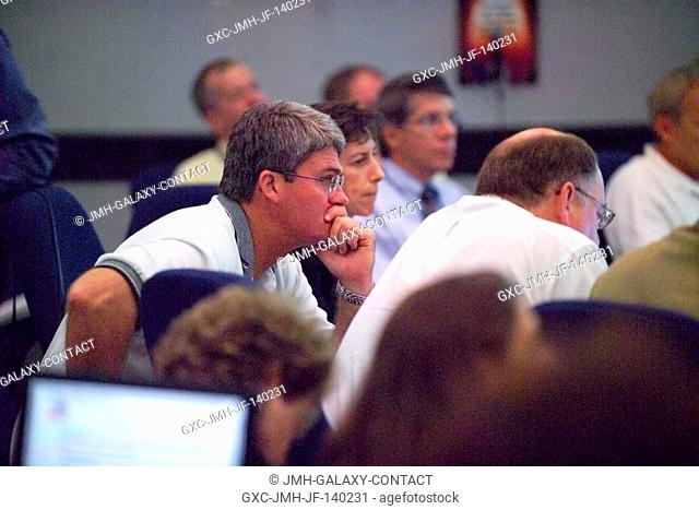 William W. Parsons (left), Space Shuttle Program Manager, listens during an open discussion at a July 28 meeting. N. Wayne Hale