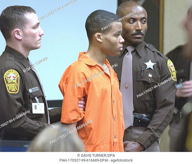 Sniper suspect Lee Boyd Malvo, center, is surrounded by deputies as he is brought into court to be identified by a witness during the trial of sniper suspect...