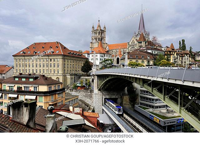 Metro railway on St-Martin bridge under the Bessieres bridge with the Cathedral of Notre Dame in background, Lausanne, Canton of Vaud, Switzerland, Europe