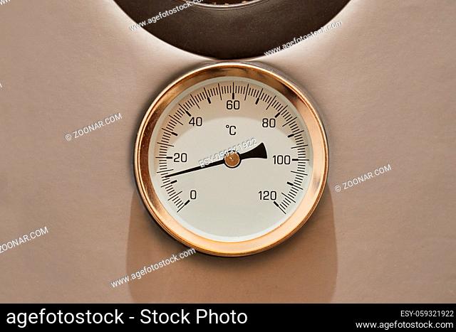 Thermometer on a water boiler rising