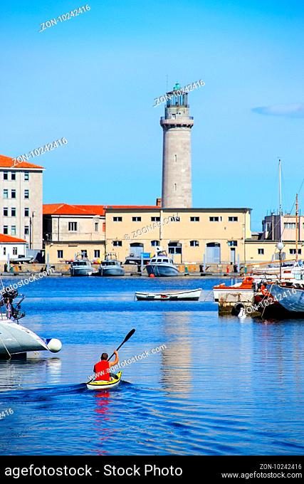 Boat marina and lighthouse in Trieste, Italy. Trieste is the capital of the autonomous region Friuli-Venezia Giulia