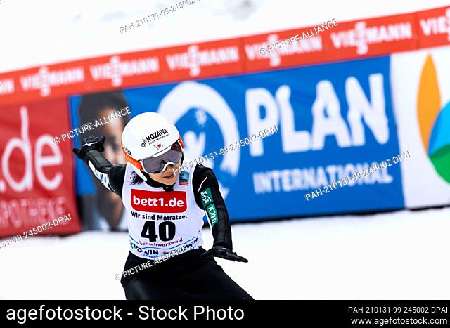 31 January 2021, Baden-Wuerttemberg, Titisee-Neustadt: Nordic skiing/ski jumping, World Cup, 2nd round: Japan's Nozomi Maruyama skis through the run-out zone...