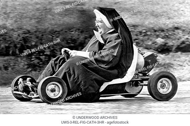 Akron, Ohio: October 10. 1962.Sister John Bosco of the St. Sebastian School in Akron having fun tooling around a go-kart track