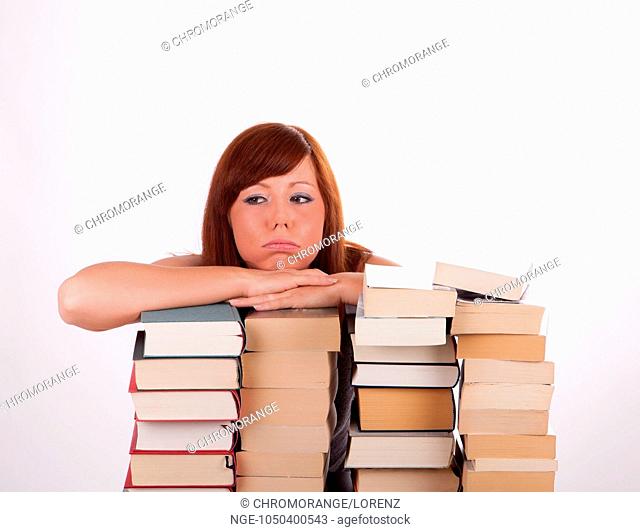A young beautiful woman with lots of books