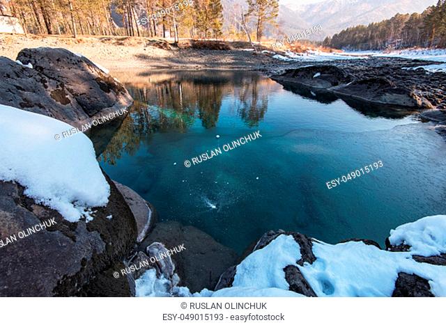 Crystal pure water of blue lake in Altai mountains