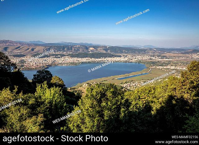 Greece, Epirus, Ioannina, View of Lake Pamvotida and surrounding city in summer