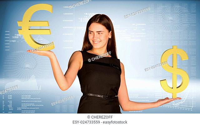 Smiling businesswoman in black dress holding dollar and euro signs. Graphs and texts as backdrop