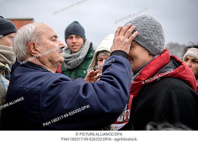 17 March 2018, Germany, Unterflossing: Self-appointed seer, Salvatore Caputa (L), blessing his followers after the apparent apperance of the Virgin Mary at the...