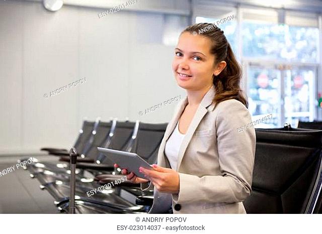 Businesswoman Using Tablet Computer At Airport Lobby