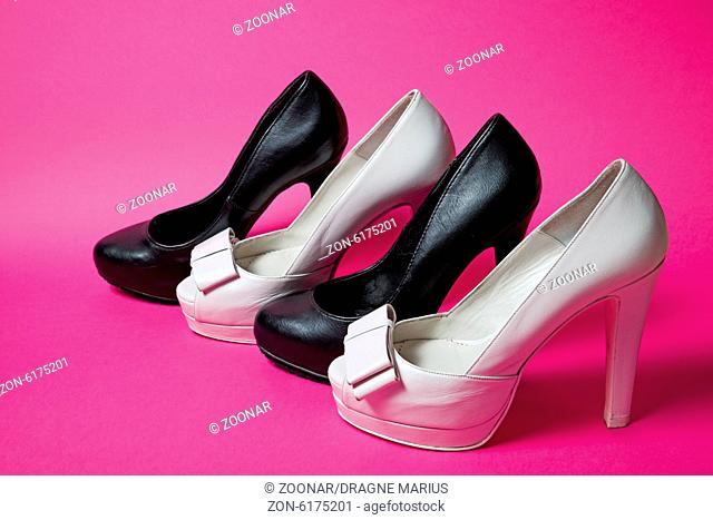 Woman shoes on pink background