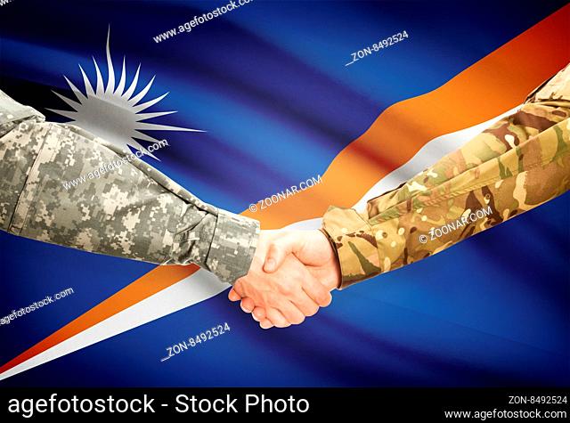 Soldiers shaking hands with flag on background - Marshall Islands