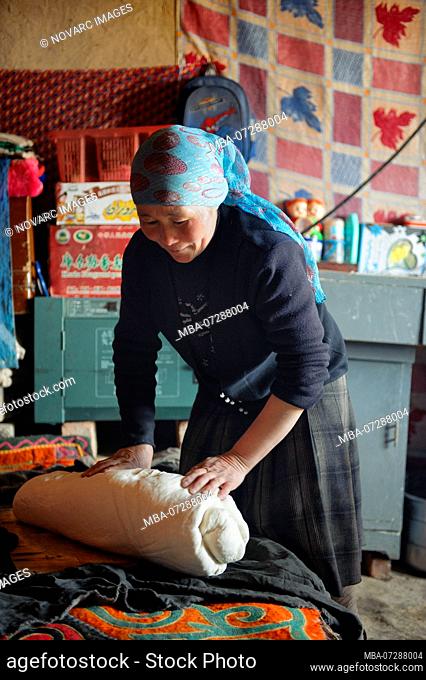 Traditional Uighur women in remote Xinjiang stay all day in the house doing the daily chores. Cooking, baking bread, preparing tea, look after the children