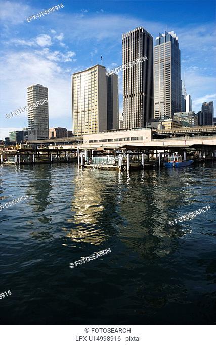 Circular Quay Railway Station in Sydney Cove with view of downtown skyscrapers in Sydney, Australia
