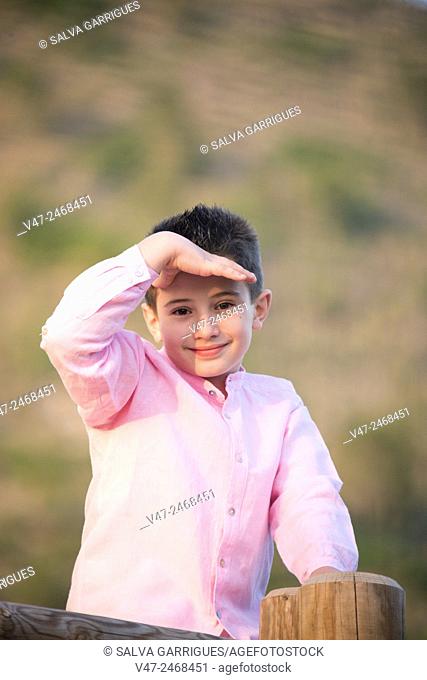 Boy posing for camera eye shadow by hand