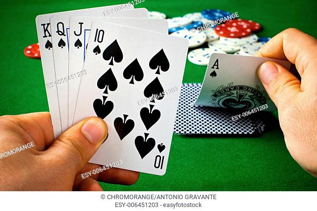 Poker cards on green table