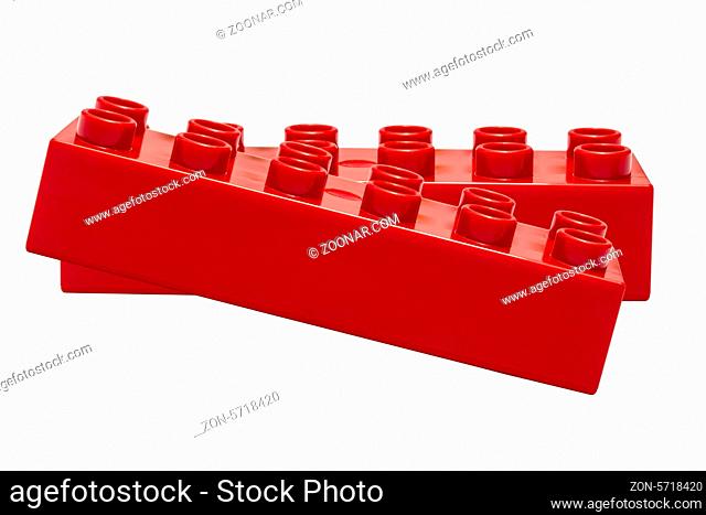 Red building block closeup on white background