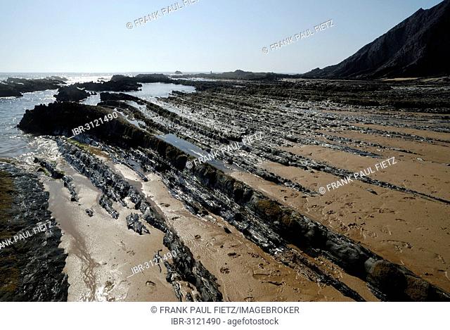 Rocks on the beach, on the Atlantic coast, Praia da Amoreira beach, Aljezur, Faro District, Portugal