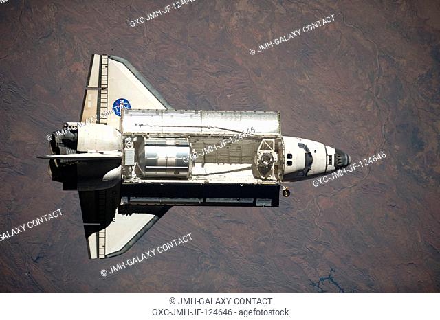 Space Shuttle Discovery is featured in this image photographed by an Expedition 20 crew member as the shuttle approaches the International Space Station during...