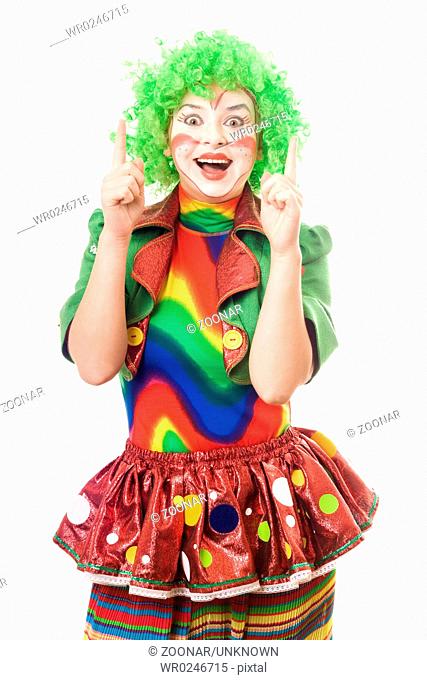 Portrait of female clown point a fingers up