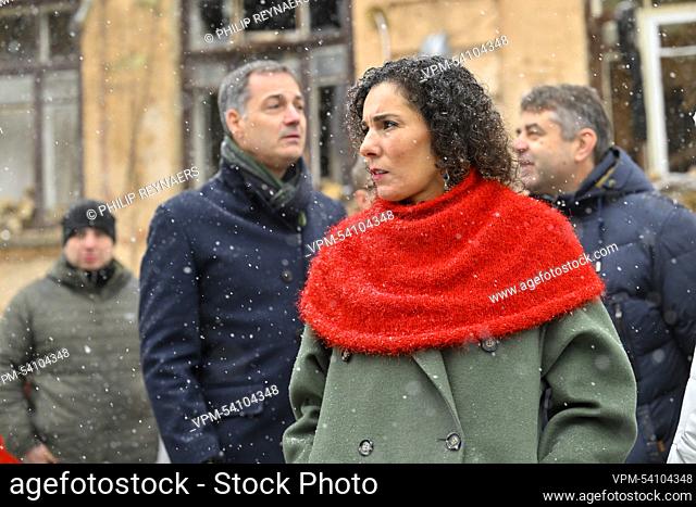 Prime Minister Alexander De Croo and Foreign minister Hadja Lahbib pictured during a visit to destroyed buildings on Triokhsviatytelska street in the city...