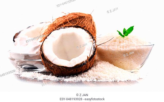 Composition with shredded coconut and shells isolated on white background