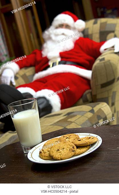 Santa sleeping on chair