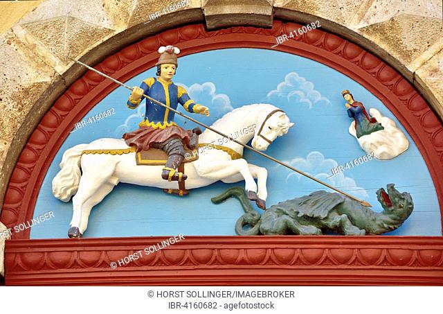 Wooden relief on the portal of the parish church of St. George, depicting George the Dragon Slayer, Sveti Juraj Lovran, Primorje-Gorski Kotar County, Istria