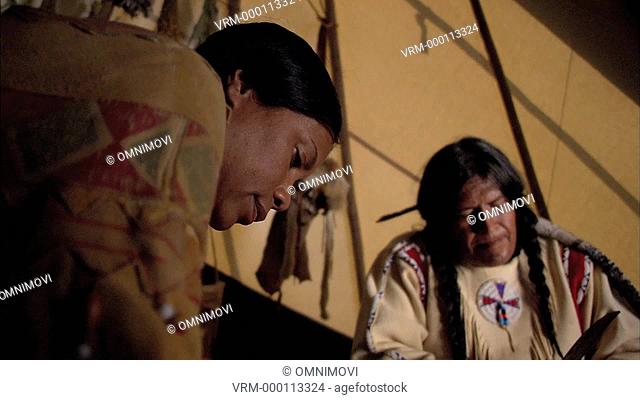 MS Male and female Native American Indian inside teepee / Bron Heulog, Llanfaur TH, Abergele, Wales, UK