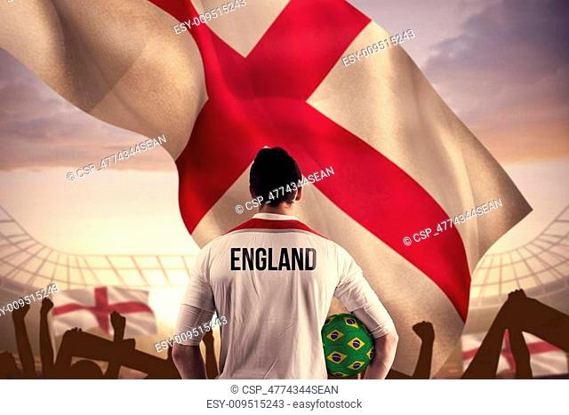 Composite image of england football player holding ball