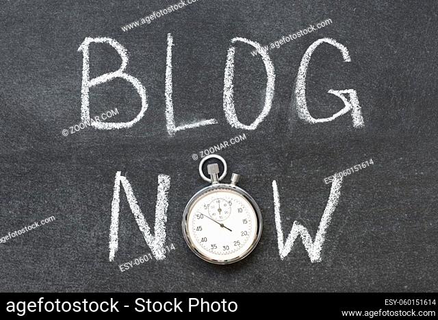 blog now concept handwritten on chalkboard with vintage precise stopwatch used instead of O