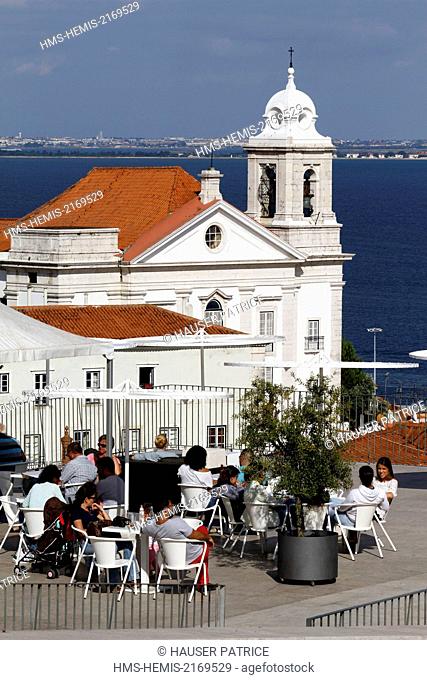 Portugal, Lisbon, Alfama, Miradouro Portas do Sol, restaurant Portas do Sol, the church of Santo Estevao background