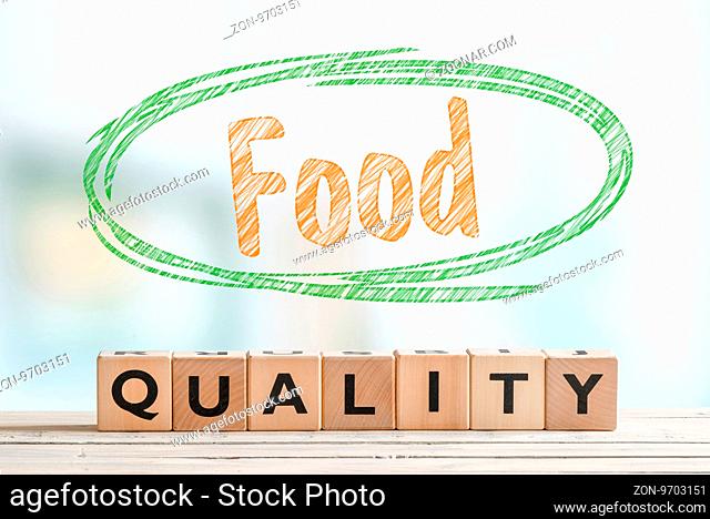 Food quality sign made of wooden cubes on a table
