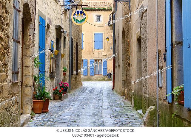 Typical street in Lagrasse town, french village listed as one of the Most Beautiful Villages of France. In the Aude department, and Languedoc-Roussillon region