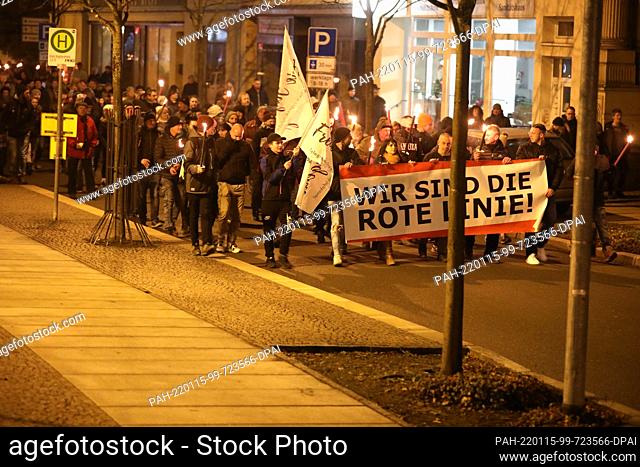 15 January 2022, Thuringia, Greiz: ""We are the Red Line"" is written on a poster of participants of a demonstration against the Corona measures in the city...