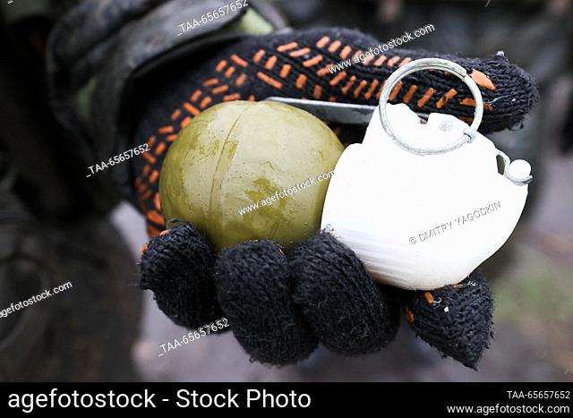 RUSSIA, DONETSK PEOPLE'S REPUBLIC - DECEMBER 11, 2023: A serviceman holds a grenade in his hand as team training takes place for combat units of the 9th Motor...